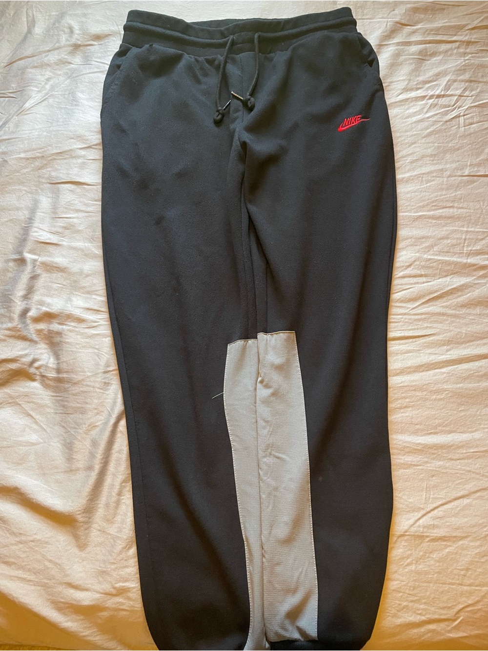 Nike Black Joggers with Gray Leg Panel and Red Swoosh